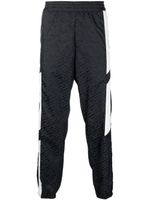 Versace pantalon de jogging à logo imprimé - Noir