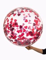 Bubbel ballon met rode hartjes confetti - thumbnail