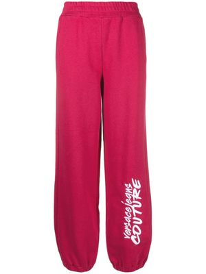 Versace Jeans Couture pantalon de jogging à logo imprimé - Rose