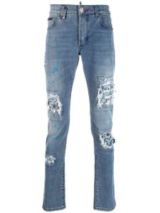 Philipp Plein jean slim à finitions effilochées - Bleu