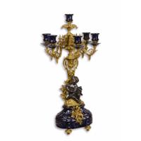 A PORCELAIN MOUNTED SIX-LIGHT BRONZE CANDELABRUM A PORCELAIN MOUNTED SIX-LIGHT BRONZE CANDELABRUM