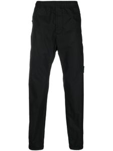 Stone Island pantalon de jogging à patch Compass - Noir