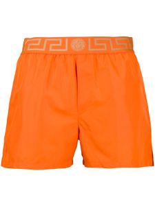 Versace short de bain à détail Greca - Orange