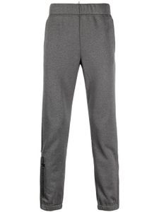 Moncler Grenoble pantalon de jogging à logo imprimé - Gris