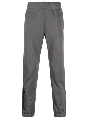 Moncler Grenoble pantalon de jogging à logo imprimé - Gris