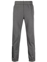 Moncler Grenoble pantalon de jogging à logo imprimé - Gris