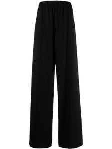 VETEMENTS pantalon de jogging à logo imprimé - Noir