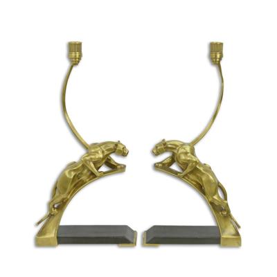 A PAIR OF BRONZE ART DECO PANTHER CANDLEHOLDERS