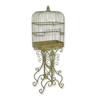 AN IRON BIRDCAGE ON STAND