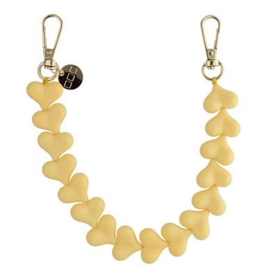 Telefoonkoord Heart - Botergeel - Goud Telefoonkoord Heart - Botergeel - Goud