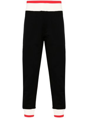 Alexander McQueen pantalon de jogging à logo imprimé - Noir