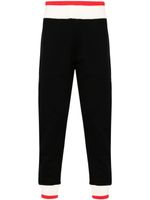 Alexander McQueen pantalon de jogging à logo imprimé - Noir