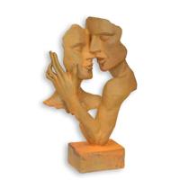 A RUSTY CAST IRON BUST OF A KISSING COUPLE A RUSTY CAST IRON BUST OF A KISSING COUPLE
