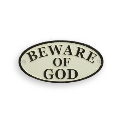 A CAST IRON "BEWARE OF GOD" PLAQUE