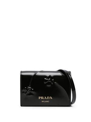Prada portefeuille à main à fleurs embossées - Noir