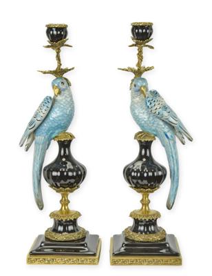 A PAIR OF BRONZE MOUNTED PORCELAIN PARROT CANDLE HOLDERS