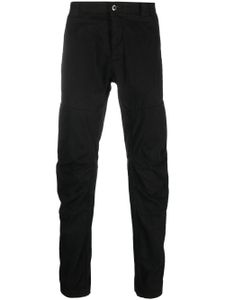 C.P. Company logo-patch tapered-leg trousers - Noir