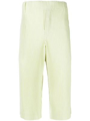 Homme Plissé Issey Miyake short ajusté à plis marqués - Jaune Homme Plissé Issey Miyake short ajusté à plis marqués - Jaune