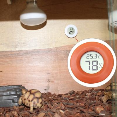 Digitale ronde gevormde Reptile vak heeft Thermometer & Hygrometer met de vertoning van het scherm (oranje)