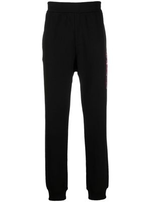 Versace pantalon de jogging à logo imprimé - Noir