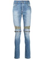 AMIRI jean skinny à détail de patch - Bleu