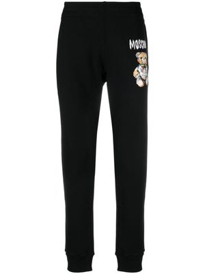 Moschino pantalon de jogging à logo imprimé - Noir