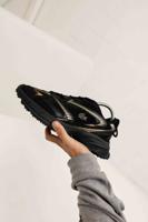 Lacoste L003 NEO Shot Heren Zwart/Goud - Maat 45 - Kleur: GoudZwart | Soccerfanshop