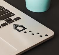 Laptop sticker voetafdrukken hond