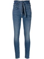 MOTHER jean The Triple Stack skinny à taille nouée - Bleu