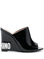 Moschino mules compensées à logo embossé - Noir