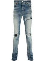 AMIRI jean skinny à effet usé - Bleu