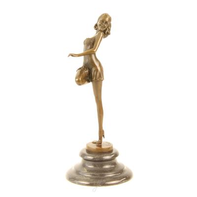 A BRONZE SCULPTURE OF A DANCER