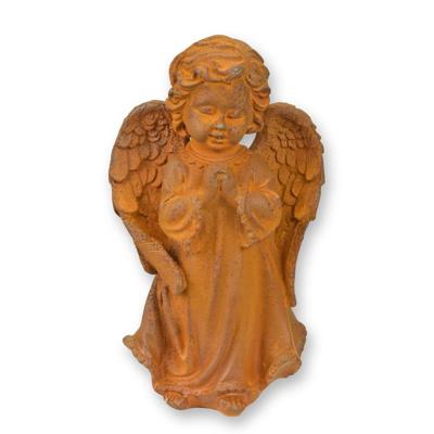 A RUSTY CAST IRON FIGURINE OF A PRAYING PUTTO
