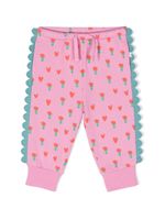 Stella McCartney Kids pantalon fleurie à ourlest festonés - Rose