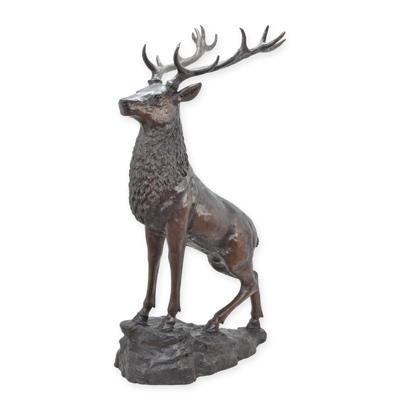 A BRONZE SCULPTURE OF A DEER