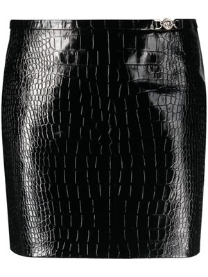 Versace minijupe en cuir à effet peau de crocodile - Noir