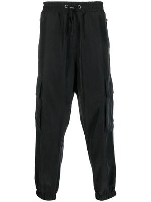 Balmain pantalon cargo à logo embossé - Noir
