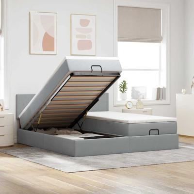 Ottoman bed met matrassen en LED's 180x200cm stof lichtgrijs