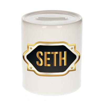 Spaarpot met voornaam Seth - wit - goud/zwart embleem - 8 x 9 cm - keramiek - afsluitdop Spaarpot met voornaam Seth - wit - goud/zwart embleem - 8 x 9 cm - keramiek - afsluitdop