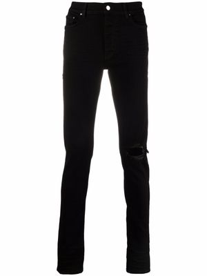 AMIRI jean slim à effet usé - Noir