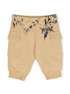 Moschino Kids pantalon de jogging à effet taches de peinture - Tons neutres