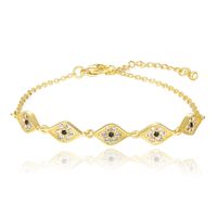 Goudkleurige Damesarmband met Witte en Zwarte Steentjes
