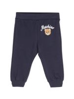 Moschino Kids pantalon de jogging en coton à logo imprimé - Bleu