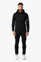 Quotrell Aruba Hooded Trainingspak Heren Zwart/Rood - Maat XS - Kleur: Zwart | Soccerfanshop