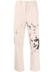 KidSuper pantalon droit à visages brodés - Tons neutres