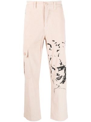 KidSuper pantalon droit à visages brodés - Tons neutres