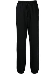 MSGM pantalon de jogging en coton à logo imprimé - Noir