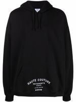VETEMENTS hoodie oversize à logo imprimé - Noir VETEMENTS hoodie oversize à logo imprimé - Noir