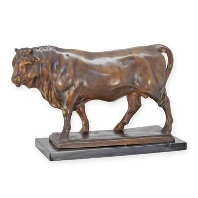 A BRONZE SCULPTURE OF A STANDING BULL