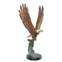 A BRONZE SCULPTURE OF AN EAGLE IN FLIGHT A BRONZE SCULPTURE OF AN EAGLE IN FLIGHT
